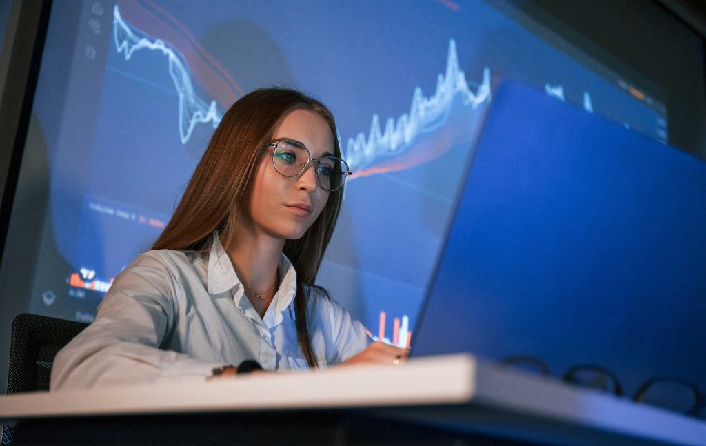 In glasses female stock broker is working indoors 2023 11 27 05 22 04 utc.jpg