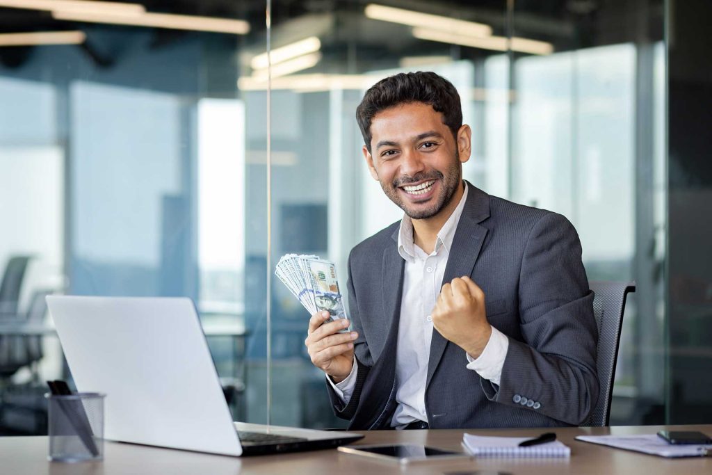 Surprised happy man businessman sitting in modern 2023 11 27 05 35 26 utc.jpg